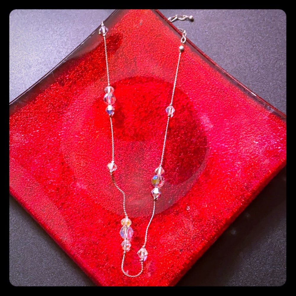Rainbow beaded necklace on silver plated chain.